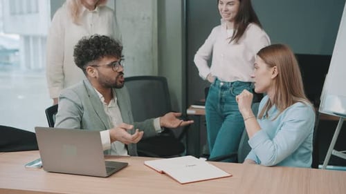 Engaging business discussion among team members in modern office environment during work hours