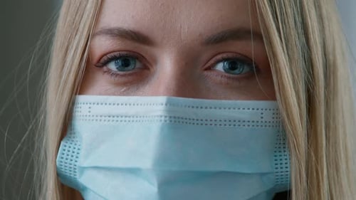 Woman Wearing a Protective Face Mask Close Up