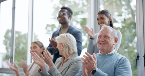 Diverse Business Team Applauding Success in Modern Office