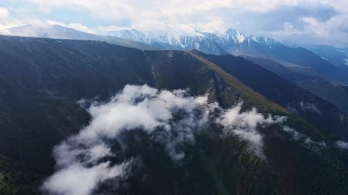 Drone Captures Green Mountains and Cloudfilled Valley Captivating Scenery