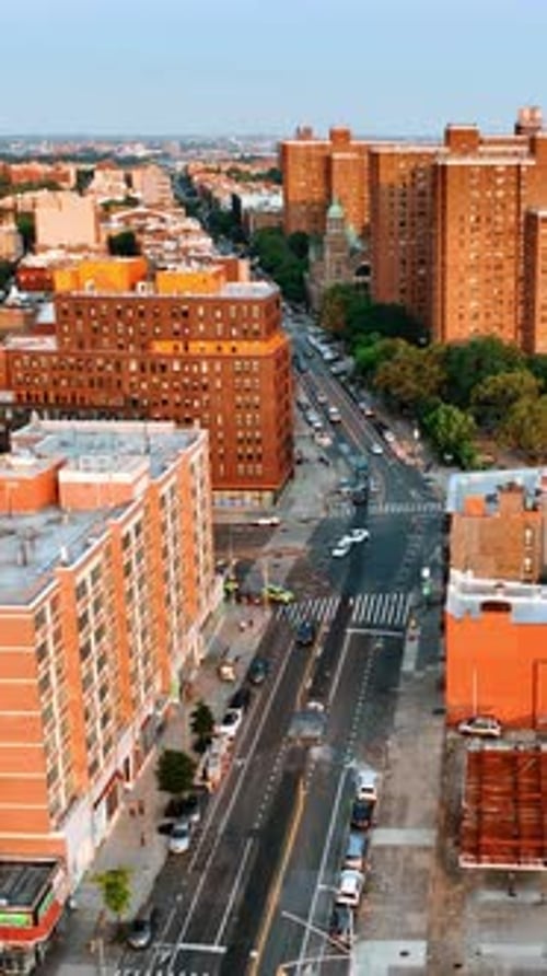 Setting sun lighting the orange blocks of flats in New York.