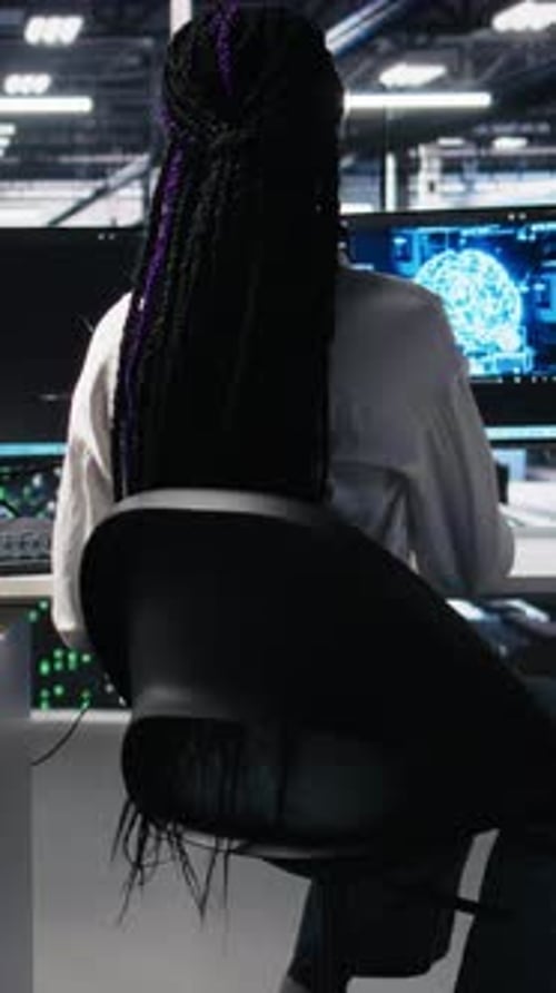 Vertical Video Data Center Female Programmer Uses Machine Learning Algorithms to Analyze Datasets