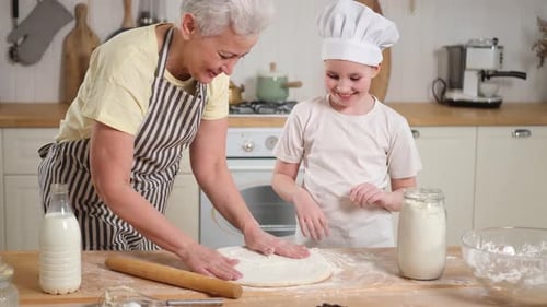 Girl and Woman Preparing Dough in Bright Kitchen