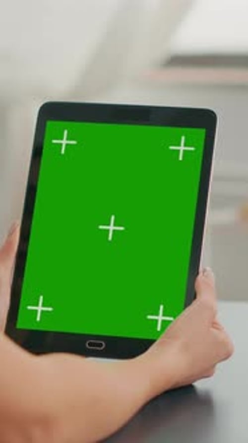 Vertical Video Freelancer Woman Holding Tablet Computer with Mock Up Green Screen