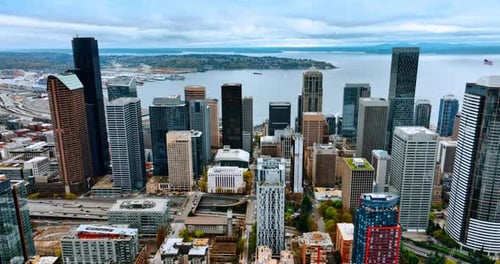 Scenery of a busy downtown at midday time. High-rise architecture of Seattle, Washington, USA