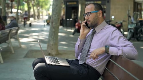 Young Professional Talking on Phone in City