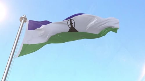 Lesotho National Flag Waving in Realistic 3D Animation Against Blue Sky