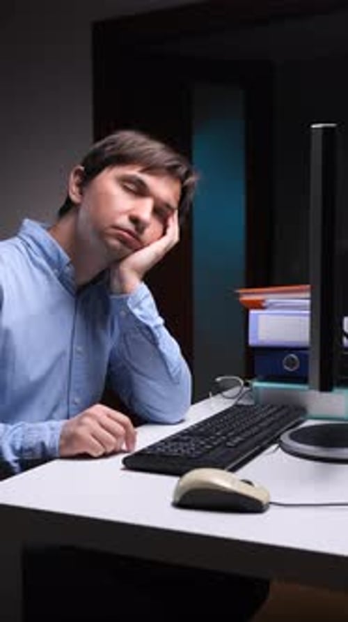 Vertical Video Tired Office Employee Falling Asleep at Work on Computer