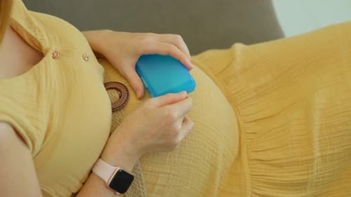Pregnant Woman Resting, Taking Pills