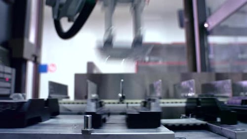 Automated robotic arm takes medicine package from pharmaceutical plant line