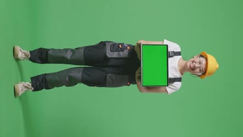 Full Body Of Asian Woman Worker Smiling And Showing Green Screen Laptop In The Green Screen