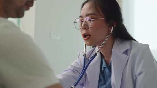 Doctor examining patient by listening lungs and breathing for Acute Respiratory Illness Clinic