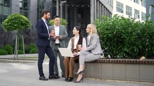 Business Colleagues Meeting Outdoors with Technology