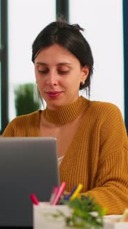 Woman Works On Laptop At Home Office
