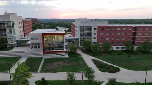 Modern college dormitories in university campus in USA. Aerial establishing shot of student housing