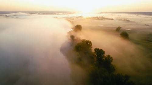 Morning Drone Flight Capturing River Landscape Wrapped In Dense Fog