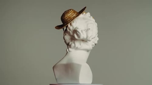 Closeup Shot Ancient Marble Bust Statue of Roman Era Woman in Small Straw Hat Spinning on a Platform