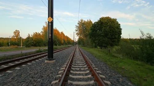 View from Train Tracks Moving Through Rural Area