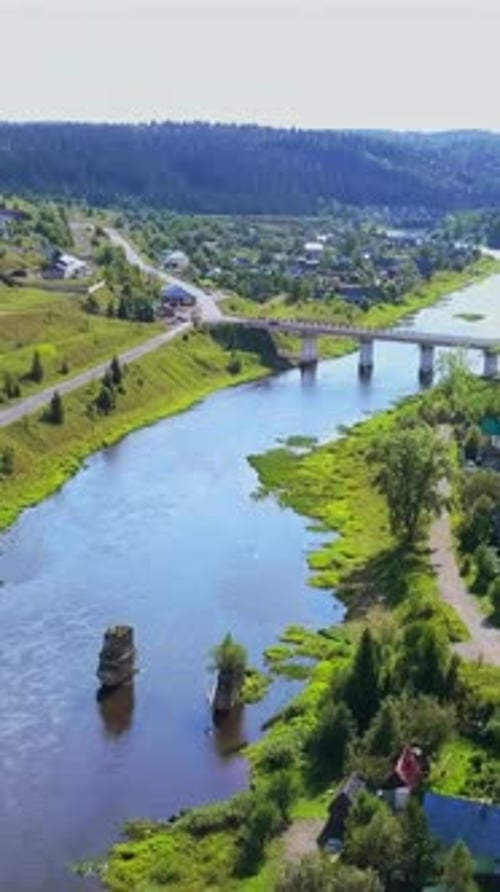 Aerial View of Countryside Natural Landscape with a Bending River Clip Small Village with Houses