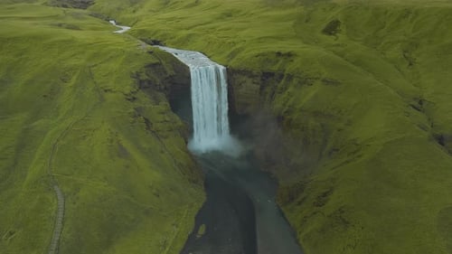 Amazing view of a majestic waterfall in Iceland. Popular tourist sightseeing destination.