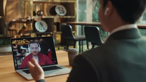 Portrait of Middle Aged Man Talks to Indian Colleague Online Laptop Screen View
