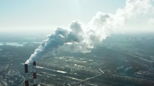 Pollution of the environment: a pipe with smoke. Power Plant.