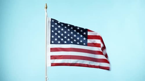 Waving American Flag on Blue Background