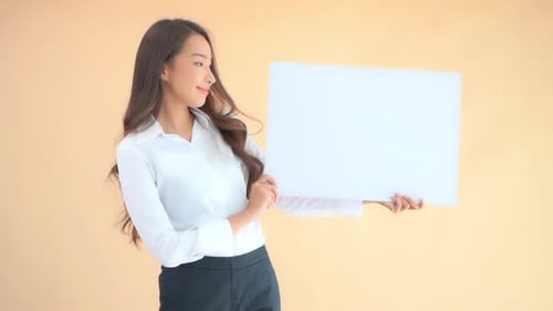 Woman Holding Blank Sign Smiling and Looking Around