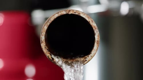 Waste Water Pipes Close Up on Factory Pouring Gasolin