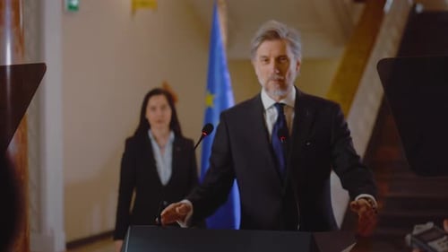 Distinguished Politician Speaking at Press Conference