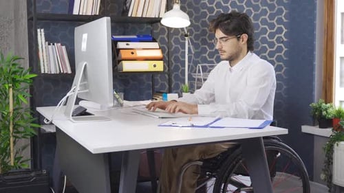 Disabled Businessman works in the office, in the company.