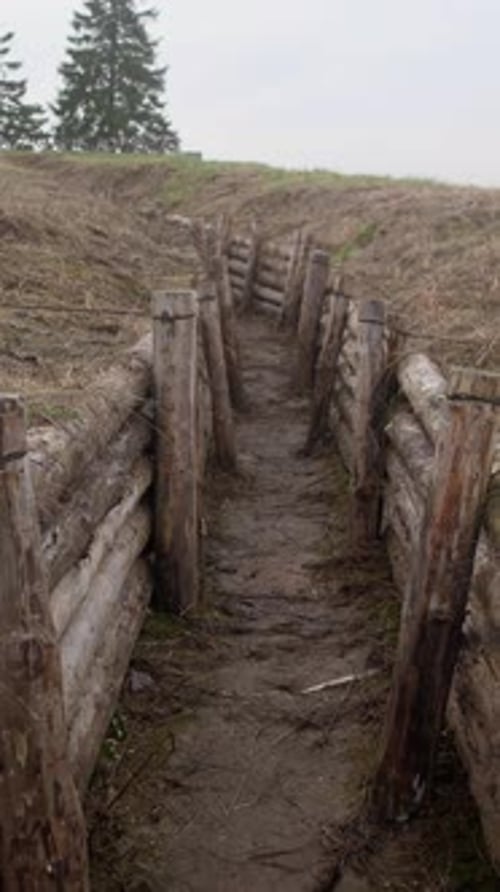 A Firstperson View of Movement Through a Military Trench at a Fortification in Ukraine or Russia