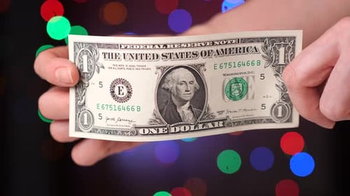 Closeup 1 One Dollar Paper Bill in a Woman's Hand