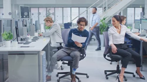 Office Colleagues Working Together in Modern Workspace