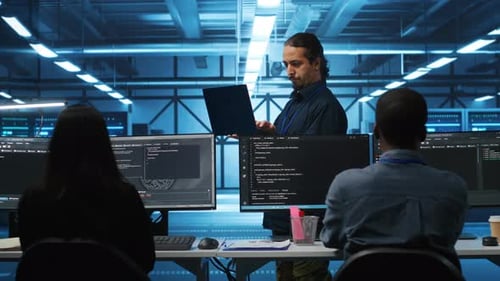 Tech Team Collaborating in Futuristic Workplace