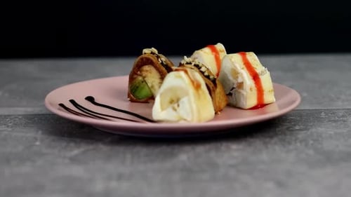 Sweet Dessert Sushi Rolls on a Plate
