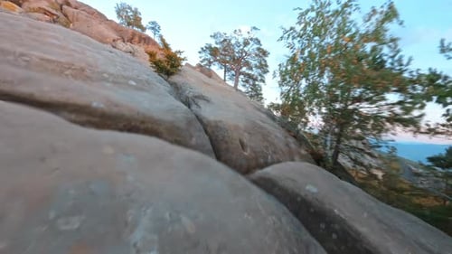 Woman Practices Yoga On Mountain Top at Sunrise