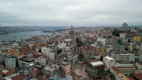 the Galata Tower and the Golden Horn strait fly backwards shot