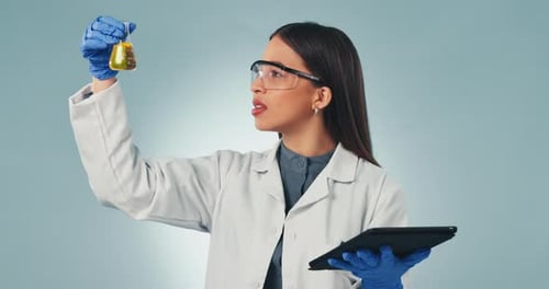 Doctor, tablet and problem solving with a science woman in studio on a gray background for research