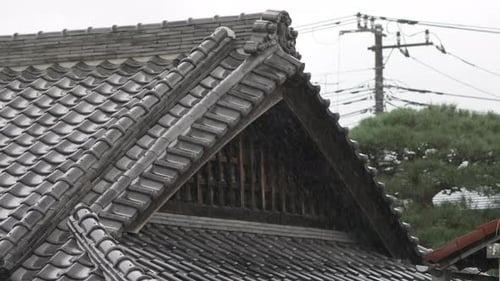Rain Downpour On Tiled Gable Roof Of A Traditional Japanese House In Tokyo, Japan. static