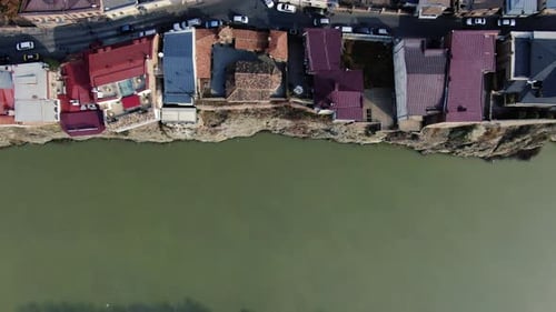 Top view of the river and a little street on top of the cliff with cars moving, 4k