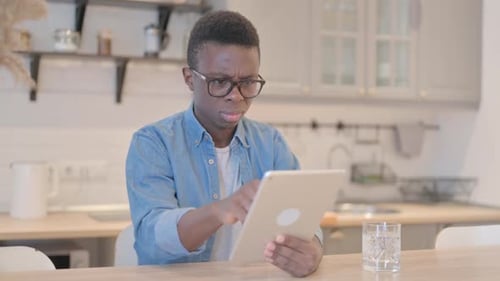 Young Adult Using Tablet in Kitchen, Technology at Home