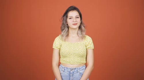 Pretty Woman Thoughtfully Gazing Upward In Studio