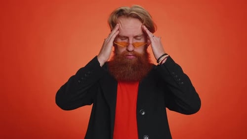 Adult with Headache Rubbing Temples