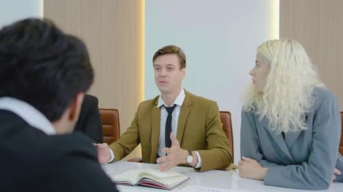 Business Meeting Discussion in a Bright Office Space