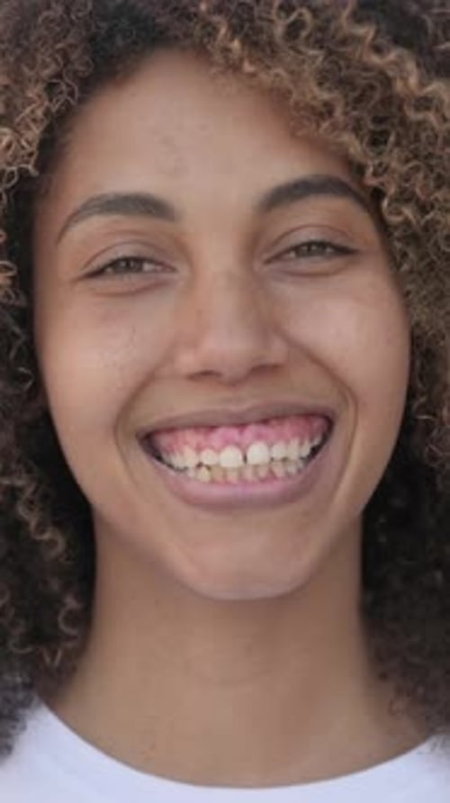 Face Close Up of African Woman Smiling at Camera, Vertical Video