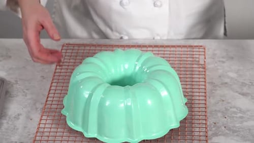 Removing Freshly Baked Funfettti Bundt Cake From the Bundt Cake Pan