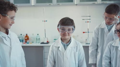 Enthusiastic Children in Science Class Wearing Lab Coats