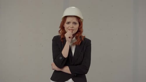 Frustrated Female Architect Nervous Worried Shrugs Her Shoulders and Spreads Her Arms Redhaired