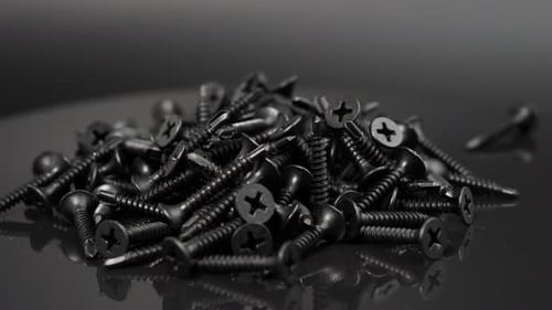 Pile of Black Screws Close Up